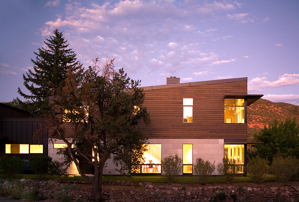 Modern home on a unique lot in Colorado, illuminated at dusk