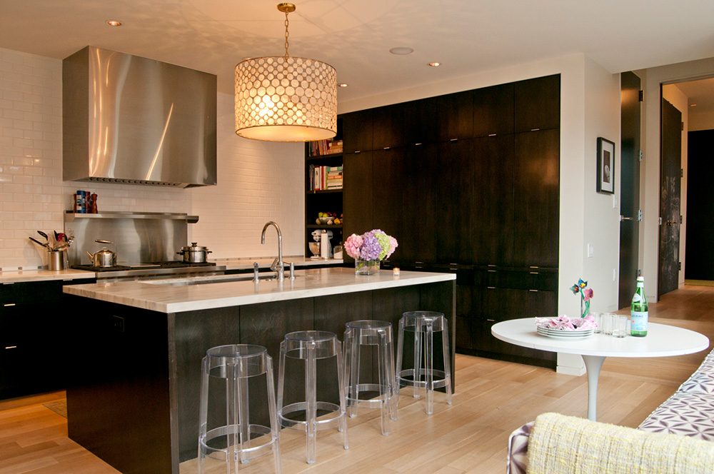Modern kitchen with large island and acrylic bar stools