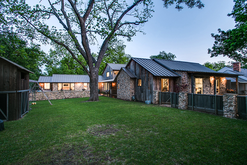Backyard in Dallas area farmhouse, with stone and wood details